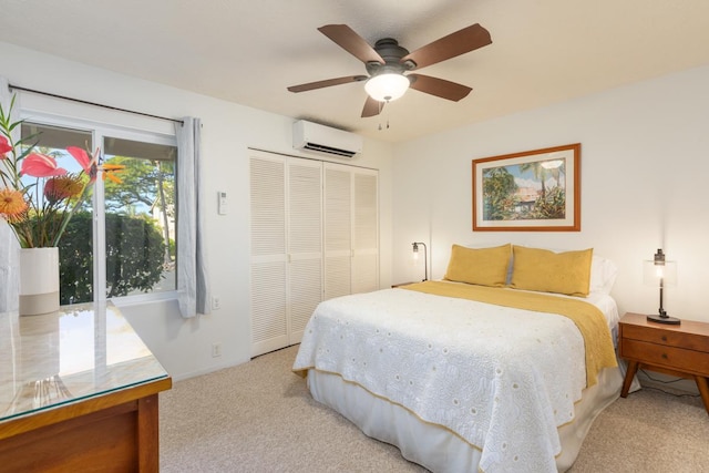 carpeted bedroom featuring a wall mounted AC, ceiling fan, and a closet