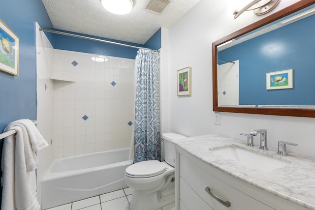 full bathroom with shower / bath combo, tile patterned floors, a textured ceiling, toilet, and vanity