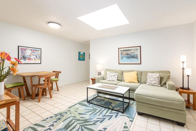 tiled living room with a skylight