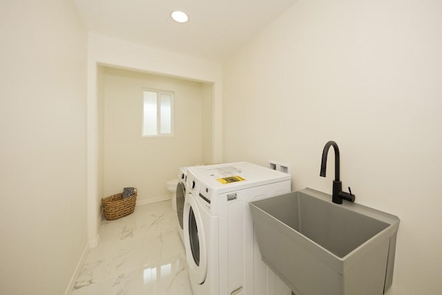 laundry area with washer / clothes dryer and sink