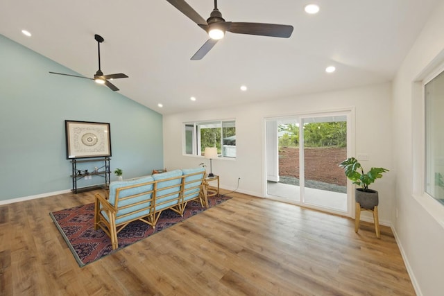 interior space featuring ceiling fan, wood-type flooring, and lofted ceiling