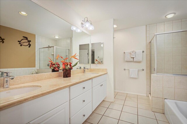 bathroom featuring tile patterned flooring, vanity, and independent shower and bath