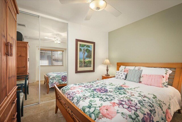 bedroom featuring ceiling fan, carpet floors, and a closet