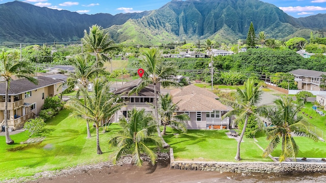 birds eye view of property with a mountain view