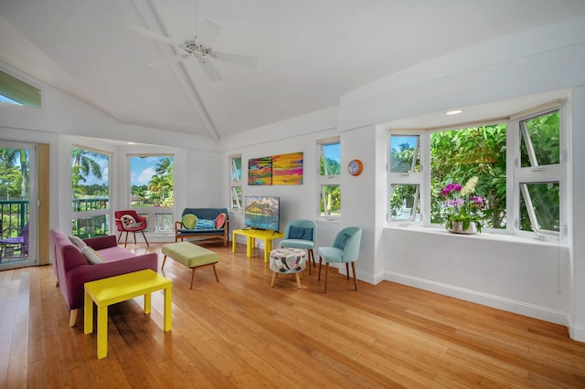 sunroom / solarium with ceiling fan and lofted ceiling