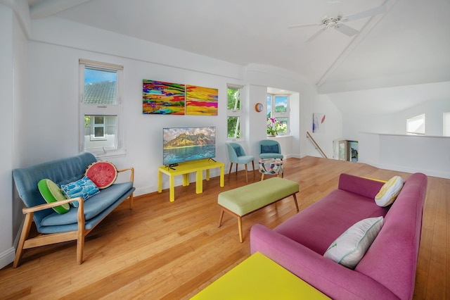 recreation room featuring wood-type flooring, vaulted ceiling, and ceiling fan