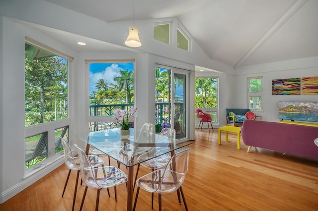 sunroom featuring vaulted ceiling