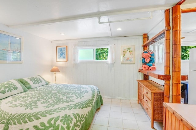 bedroom featuring wooden walls