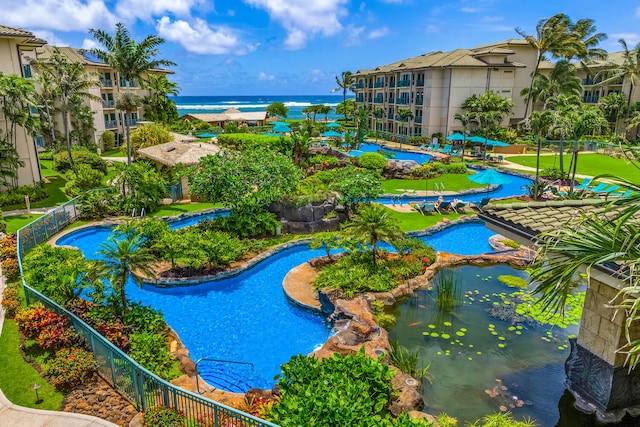 view of swimming pool with a water view