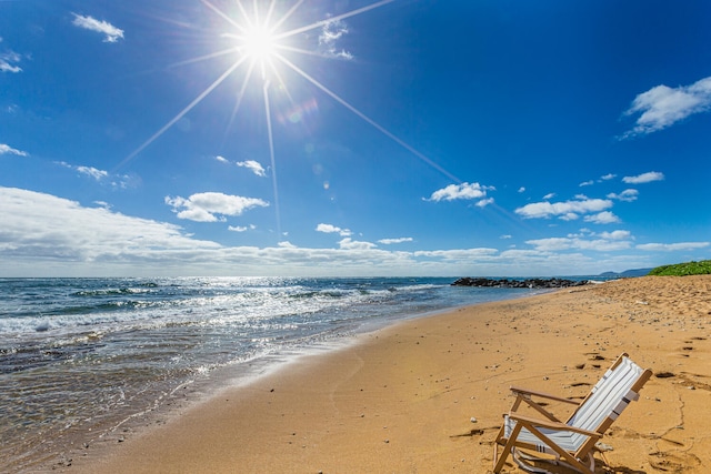 property view of water featuring a beach view