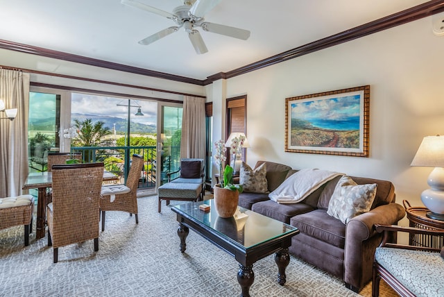 living room featuring ceiling fan and crown molding