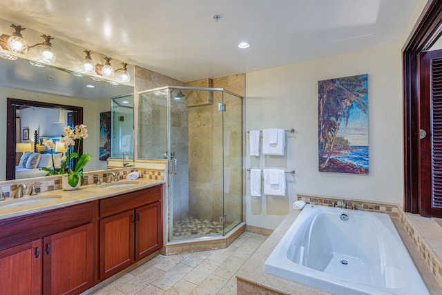 bathroom with separate shower and tub and vanity