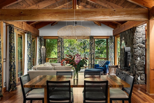 unfurnished sunroom featuring a chandelier, lofted ceiling with beams, and wooden ceiling