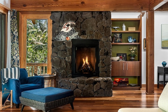 living area with a fireplace and hardwood / wood-style floors