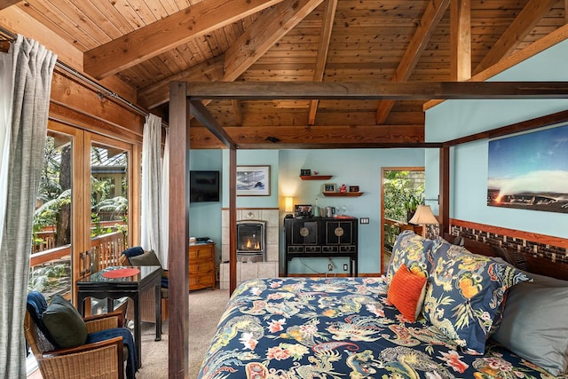 carpeted bedroom with vaulted ceiling with beams, a tiled fireplace, and wood ceiling