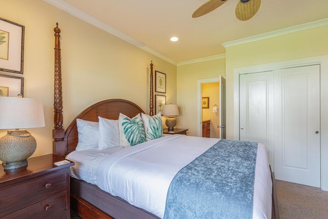 bedroom with carpet flooring, ceiling fan, ensuite bathroom, a closet, and ornamental molding