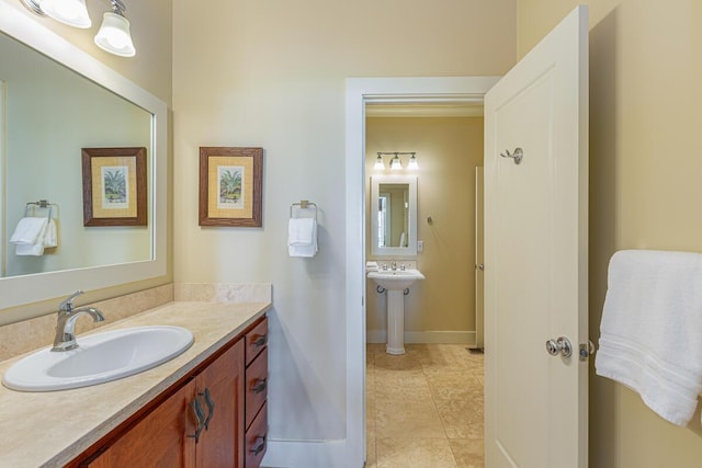 bathroom featuring tile patterned flooring and sink