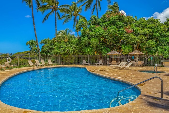 view of swimming pool with a patio