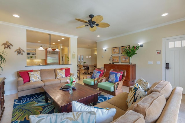 living room with ceiling fan and ornamental molding