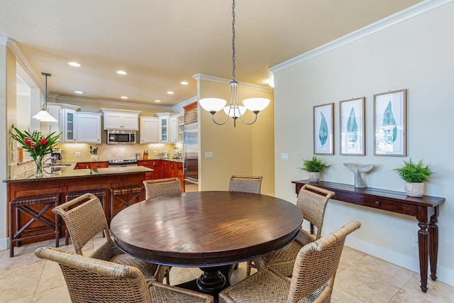 tiled dining area featuring crown molding and a chandelier