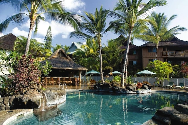 view of pool featuring exterior bar