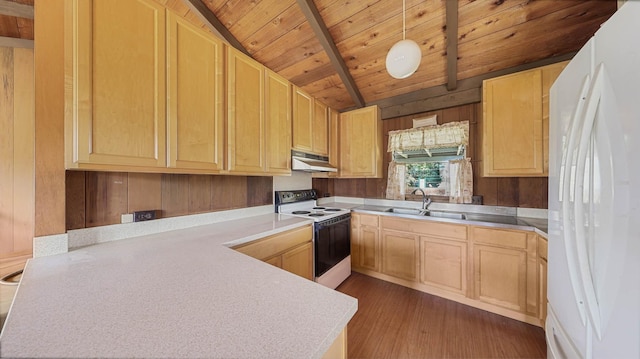 kitchen with white appliances, decorative light fixtures, light brown cabinetry, and sink