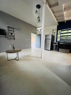 living room featuring concrete flooring