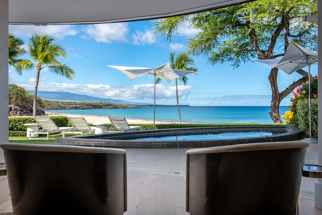 view of patio with a water view