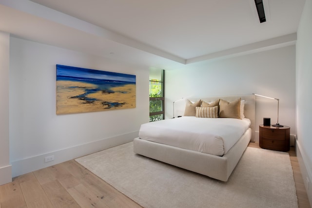 bedroom with wood-type flooring