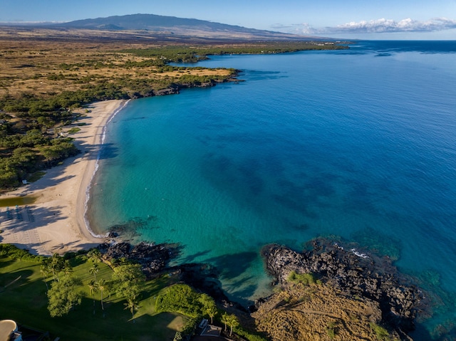 drone / aerial view with a water and mountain view