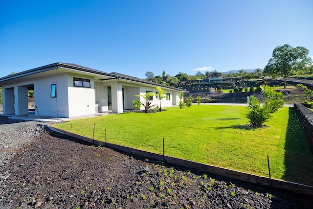 view of home's exterior featuring a yard