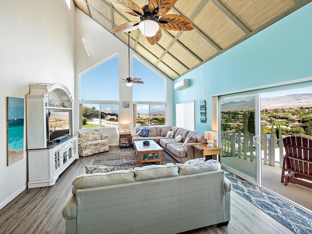 living room with ceiling fan, high vaulted ceiling, a wall unit AC, wood-type flooring, and wood ceiling