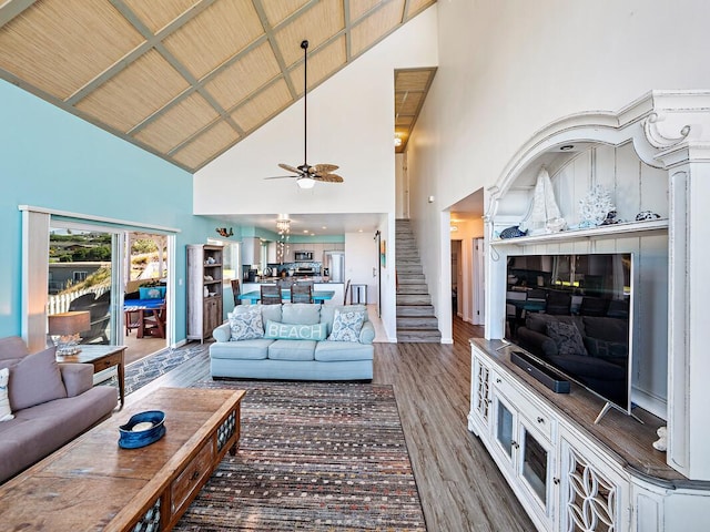 living room featuring wooden ceiling, high vaulted ceiling, dark wood-type flooring, and ceiling fan