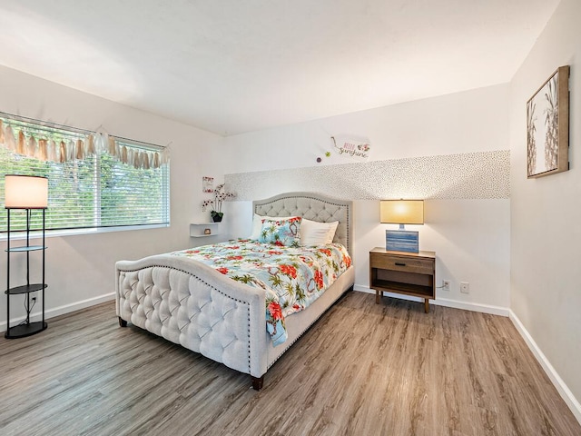 bedroom featuring wood-type flooring