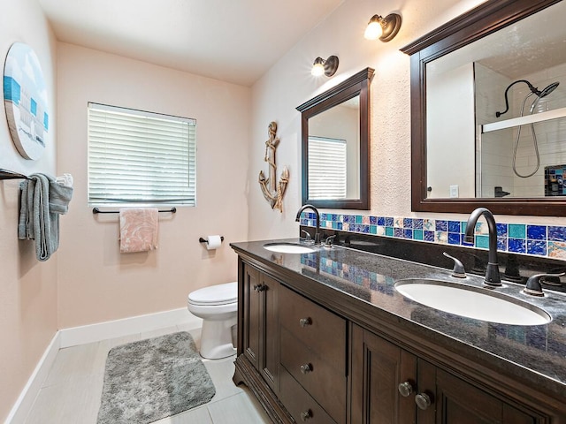 bathroom with tasteful backsplash, vanity, a shower, tile patterned flooring, and toilet