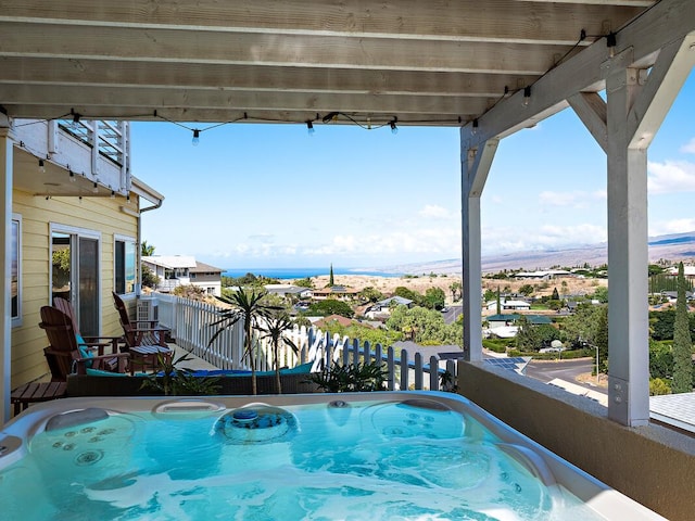 view of pool featuring a mountain view and a hot tub