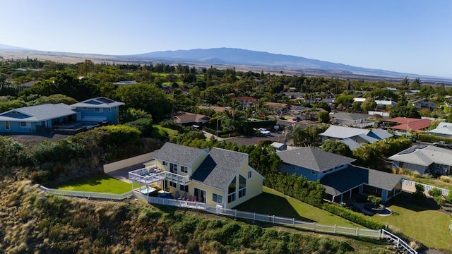 birds eye view of property with a mountain view