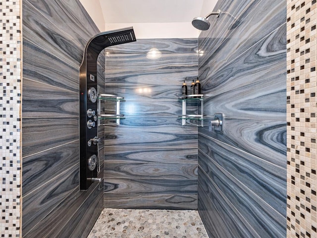 bathroom with a tile shower