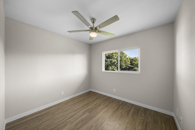 unfurnished room with dark hardwood / wood-style floors