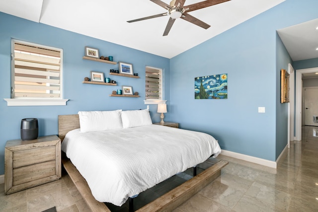 bedroom with ceiling fan and lofted ceiling