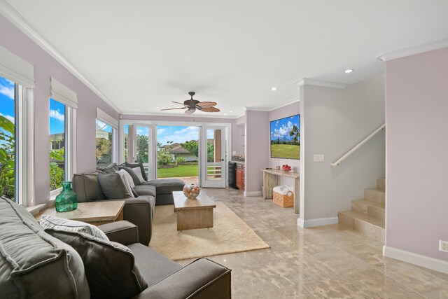 living room featuring ceiling fan and crown molding