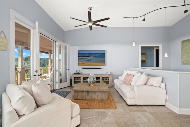 living room featuring ceiling fan, vaulted ceiling, and french doors