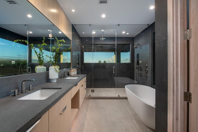 bathroom featuring plus walk in shower and vanity