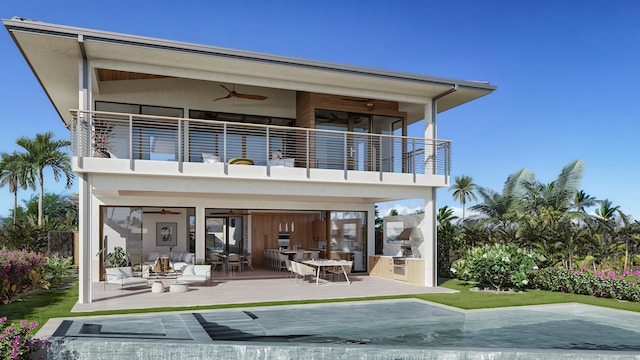 rear view of property featuring a balcony, an outdoor living space, ceiling fan, exterior kitchen, and a patio area