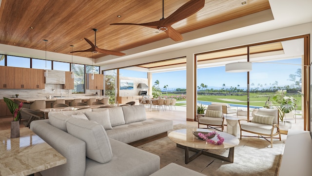 interior space with a wealth of natural light, wooden ceiling, and ceiling fan