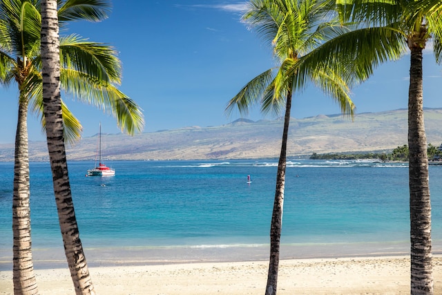 water view featuring a beach view and a mountain view