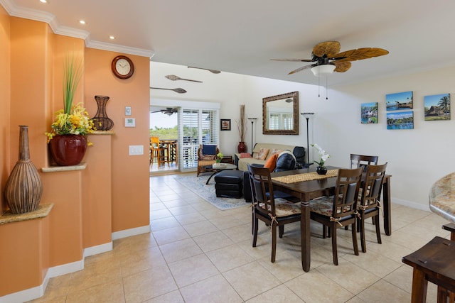 dining room with ceiling fan, light tile patterned floors, and crown molding