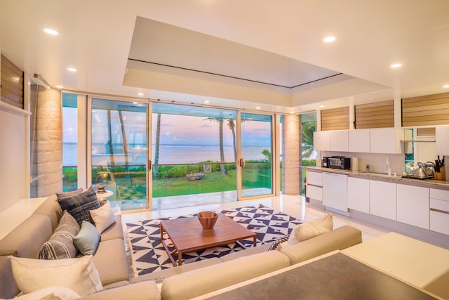 living room featuring sink and expansive windows