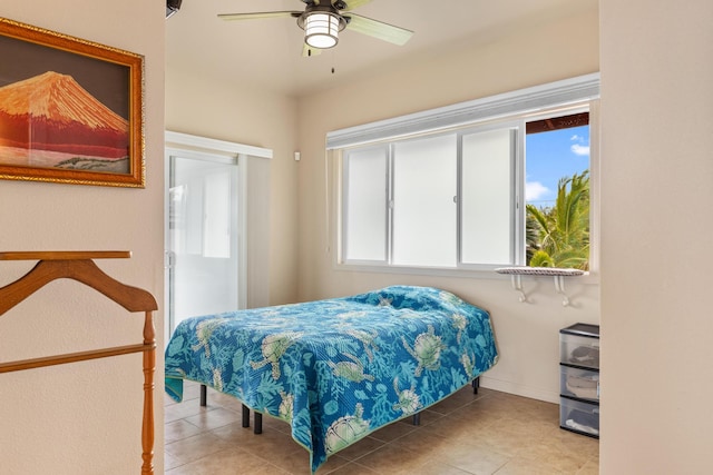 bedroom with tile patterned floors and ceiling fan