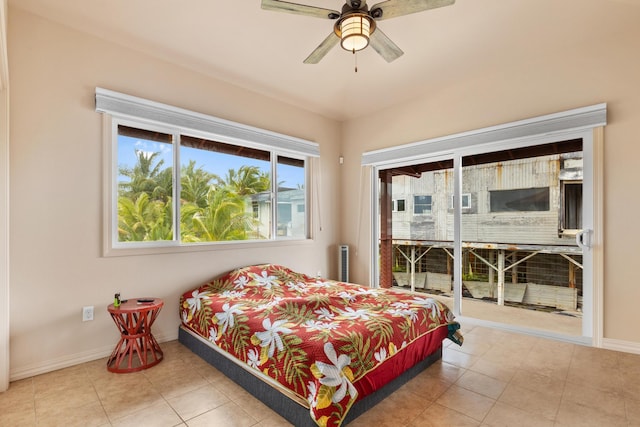 bedroom with tile patterned floors, ceiling fan, and radiator heating unit